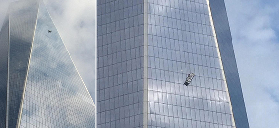 One World Trade Center and scaffold dangling outside the 69th floor of the building (Credit: Twitter via Zachary Prensky and Rex Sorgatz)