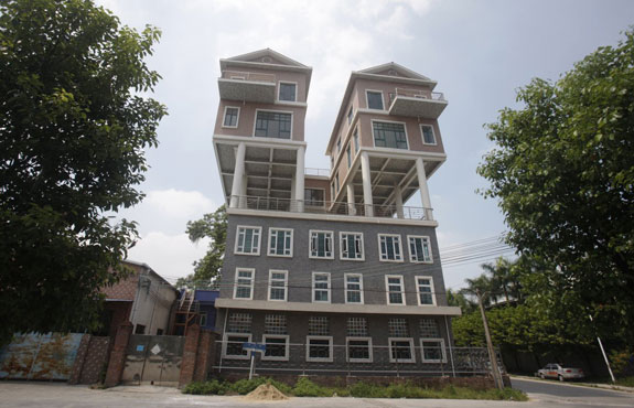 chinese-sky-high-dwellings-these-precarious-looking-houses-were-built-on-the-rooftop-of-a-factory-building-in-in-dongguan-china-the-houses-were-completed-two-years-ago-according-to-local-media-the-government-said-the