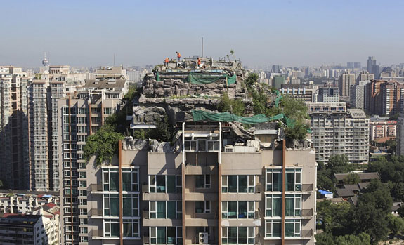 imitation-rocks-on-the-rooftop-of-a-26-story-residential-building-in-beijing-in-august-of-2013-the-elaborate-villa-complete-with-a-garden-was-built-illegally-on-top-of-a-beijing-apartme