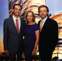 Martin Melo, left, and Carlos Melo of the Melo Group flank Alicia Cervera Lamadrid of Cervera Real Estate.