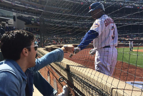 Winick Realty Group director Michael Gleicher gets a greeting from Mets outfielder Curtis Granderson at Citi Field.