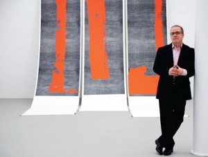 Mana Contemporary founder and executive director, Eugene Lemay, stands with his artwork, “Untitled, 2011.” Photo by Esther Montoro.