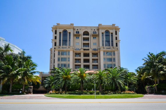 A street-level shot of the Luxuria building in Boca Raton