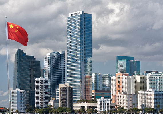 Miami's skyline from December 2011 (Credit: John Spade) and the Chinese flag