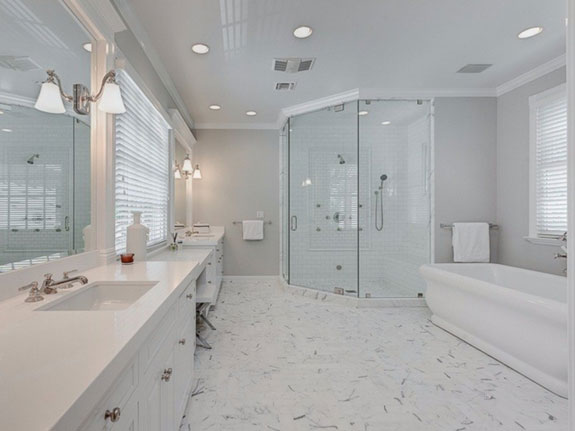 a-steam-shower-soaking-tub-and-his-and-her-sinks-line-the-walls-of-the-master-bath