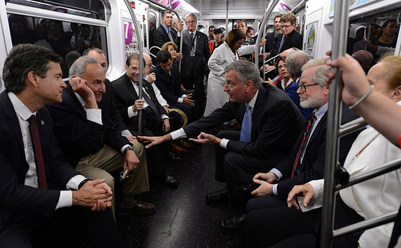 From left: Senator Chuck Shumer, Rep. Jerry Nadler, Mayor Bill de Blasio and others on the 7 train (credit: MTA via Flickr)