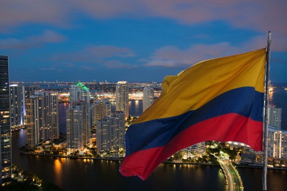 Miami's skyline (Credit: Gabriel Kaplan) and the Colombian flag (Credit: creative commons user ferchos04 II