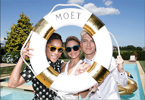 Guests at Olivia Palermo's summer luncheon at the REVOLVE Hamptons House in Sagaponack