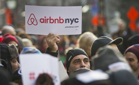 Supporters of Airbnb hold a rally outside City Hall January 20, in New York City.