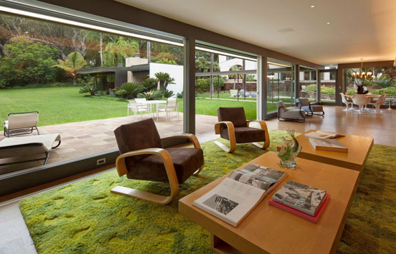 at-the-time-neutra-built-the-residence-for-stuart-and-lucia-bailey-creating-a-clean-and-crisp-living-room-that-includes-floor-to-ceiling-glass