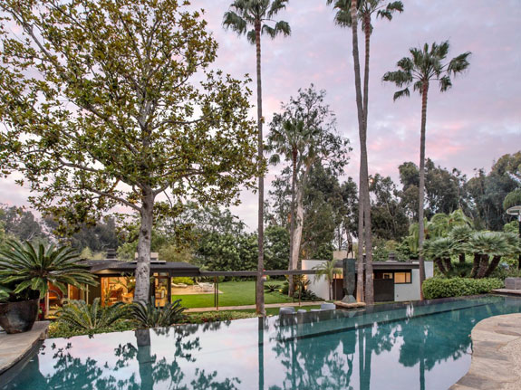 the-backyard-includes-a-beautiful-cascading-infinity-pool-it-sits-between-the-two-homes