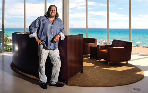 Gil Dezer steps out of his condo right onto the sand in Sunny Isles Beach.