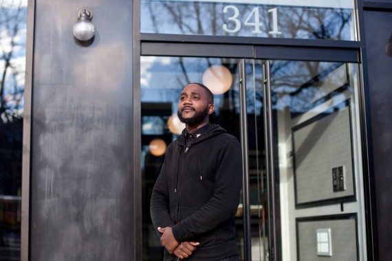 Doorman Jereme Herring poses for a portrait in front of 341 Eastern Parkway in Crown Heights (credit: Bryan Anselm for ProPublica)