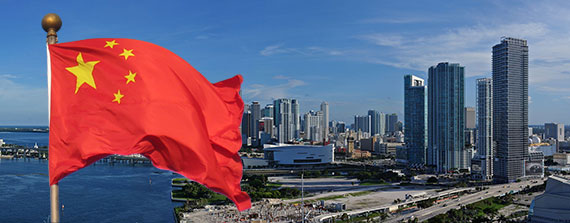 A 2011 photo of downtown Miami's skyline (Credit: Lonny Paul) and the Chinese flag (Credit: Daderot)