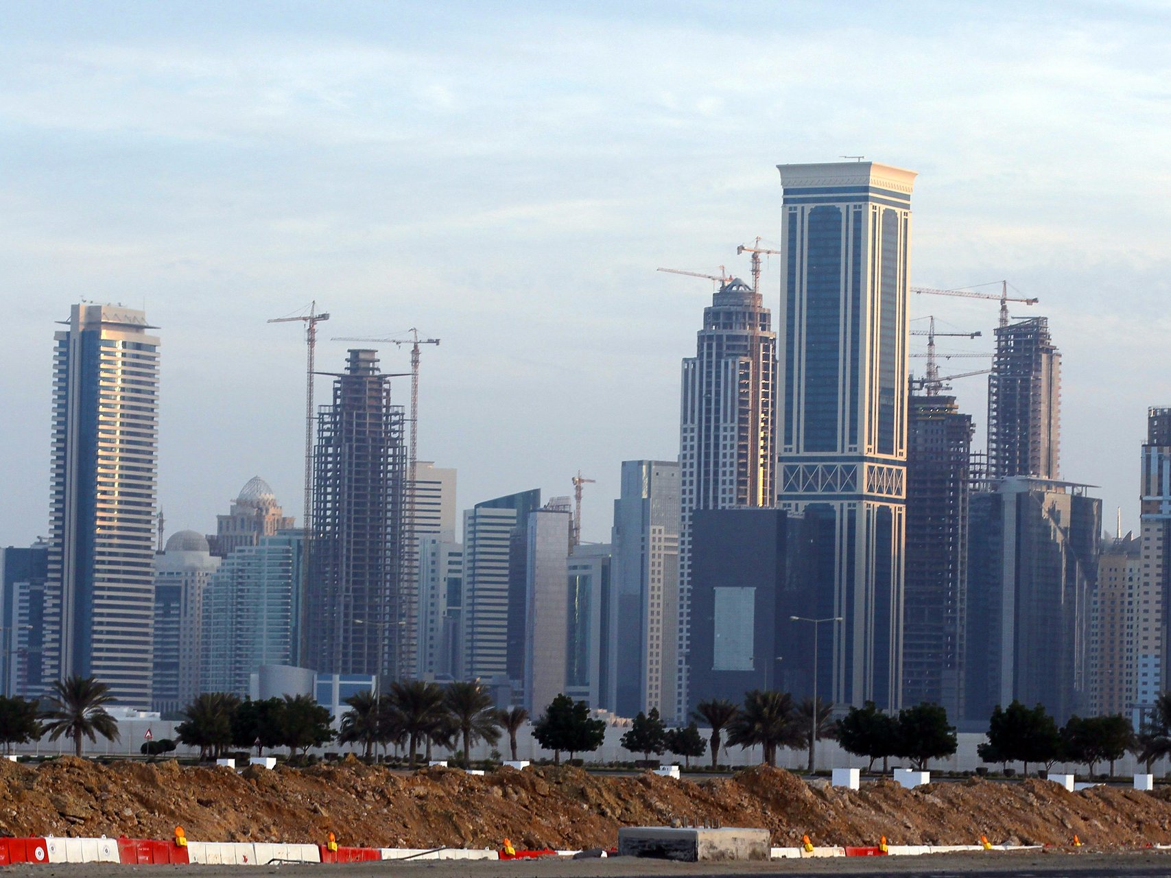 New high-rise office buildings and hotels still under construction stand in the new City Center and West Bay district in Doha, Qatar. (Getty Images)