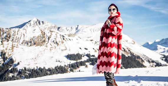 Catherine Baba poses in the snow at A Small World's Winter Weekend in Switzerland