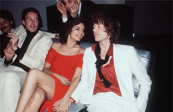 Halston, left, seated next to Bianca and Mick Jagger