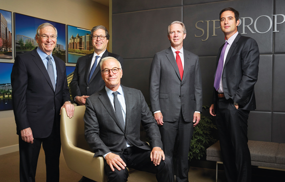 SJP Properties executives: Steven Pozycki, the founder, seated. Standing, left to right: Allen Goldman, Jeffrey Schotz, David Welch and Enrique Alonso.