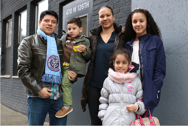 Lilian and Juan Piedra and their children were going to be evicted from their apartment until a lawyer discovered a J-51 tax break had existed for the property. As a result, they were able to stay. (Credit: Cezary Podkul/ProPublica)
