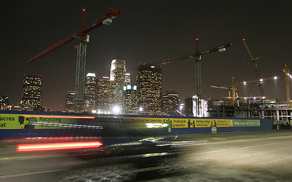 The downtown skyline is framed by cranes at a construction site near Staples Center in 2006. (Credit: Getty)