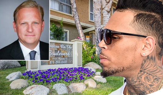 From left: Jeff Weller of Lion Real Estate, the property at 5919-5939 Reseda Boulevard and singer Chris Brown (credit: Steve Granitz, Wire Image)