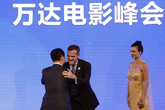 Wang Jianlin and Eric Garcetti share a hug at the event Monday night (Credit: Patrick Fallon/Bloomberg via Getty Images)