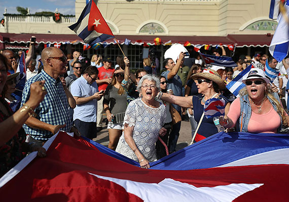 Miamians gather in the streets to celebrate Fidel Castro's death (Credit: Joe Radely / Getty Images)