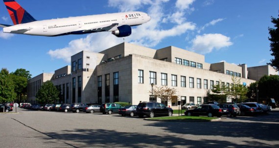 A Delta airplane and the Bulova Corporate Center at 75-20 Astoria Boulevard