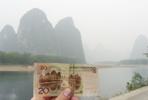 20 renminbi yuan bill shown next to the hills on the bill