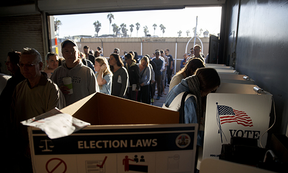 Voters wait in line to cast their ballots at the Venice Beach lifeguard station polling location in Los Angeles on Tuesday, Nov. 8, 2016. (Patrick T. Fallon/Getty Images)