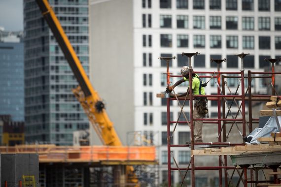 A construction laborer working on the site of a new residential building in Hudson Yards (Credit: Getty Images)