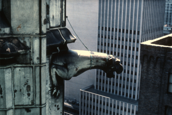 An image from the top of the Woolworth building in the 1970s. A "leash" has been fitted around the gargoyle's neck to keep it from landing on pedestrians should it detach itself from the building.The Ehrenkrantz Group/Collection of Tim Allanbrook