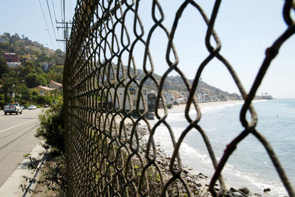 A fenced beach front area near the Pacific Coast Highway (Credit: Getty)