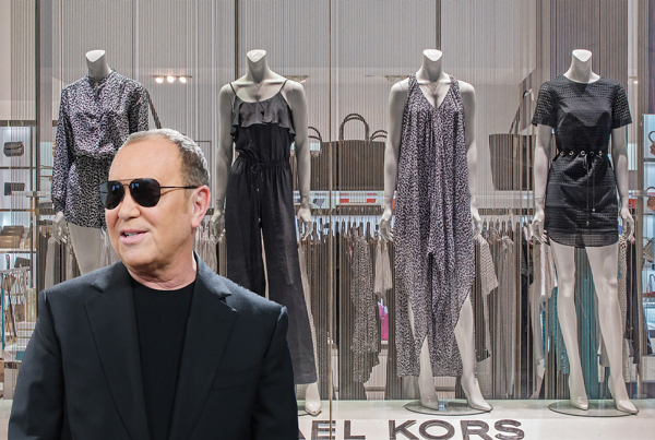Michael Kors and a Michael Kors Window Display in New York City (Credit: Getty Images)