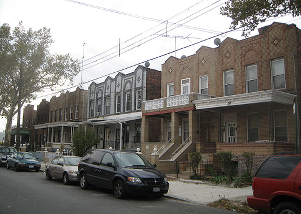 Semi-detached rowhouses on a street in East New York, Brooklyn