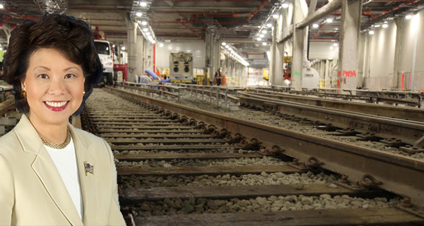 Elaine Chao and tracks inside the LIRR storage facility in Hudson Yards (Credit: Alistair Gardiner for <em>The Real Deal</em>)