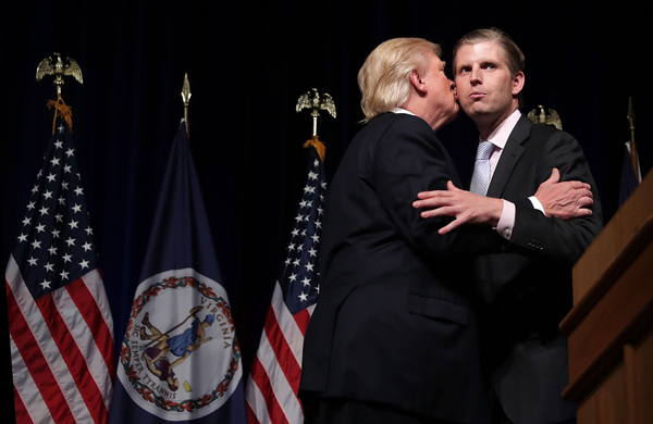 Then nominee Donald Trump kisses son Eric during a campaign event (Credit: Getty Images)