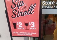 A "sip and stroll" sign outside the Lucky's Market in Coral Springs (Source: Yelp.com)