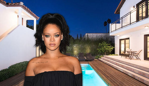 Rihanna with her West Hollywood home (Credit: Getty Images)