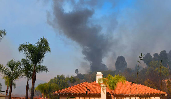 A wildfire burns in Bel Air, California (credit: Getty)