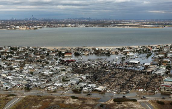 The remains of burned homes after Sandy in 2012 in the Breezy Point neighborhood of Queens (Credit: Getty Images)