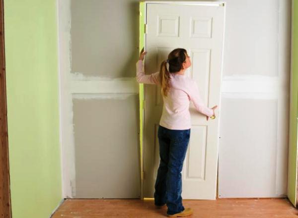 Door installation is among the types of work for which Miami will expedite permit applications. (Credit: diynetwork.com /Dorling Kindersley)