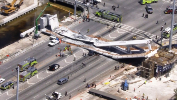 Federal agencies and county police are investigating the collapse of unfinished pedestrian bridge at FIU on Thursday. (Credit: Local10.com)