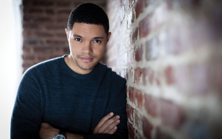 A REFLECTIVE MOOD: Trevor Noah was photographed in his office backstage at “The Daily Show.” He’s wearing a wool knit sweater by Ermenegildo Zegna, $695.