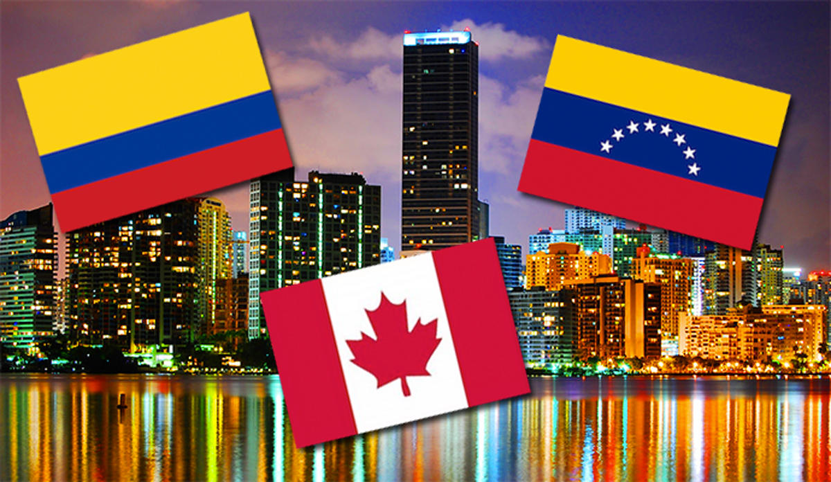 Flags of Colombia, Canada and Venezuela over the Miami skyline (Credit: Wyn Van Devanter via Flickr)