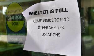 A sign at a storm shelter in Naples one day before Hurricane Irma hit the city. (Credit: Nicholas Kamm/ AFP/ Getty Images)