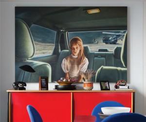 A painting by the American artist, Damien Loeb, behind a red console.