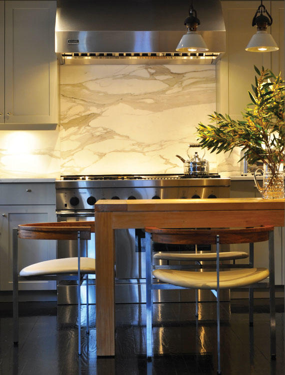 A kitchen renovation in a West Village home by MADE featuring a backsplash of Calacatta Borghini marble.