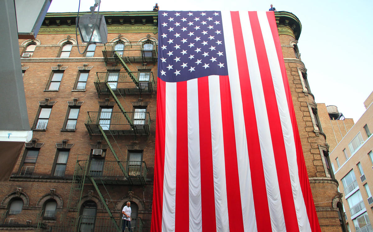 116 Mott Street and the Ground Zero Flag (Credit: Groud Zero Volunteers Flag)