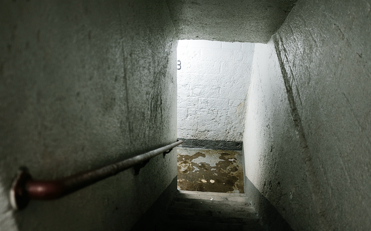 An empty and moldy stairwell stands in a public housing building in Brooklyn (Credit: Getty Images)